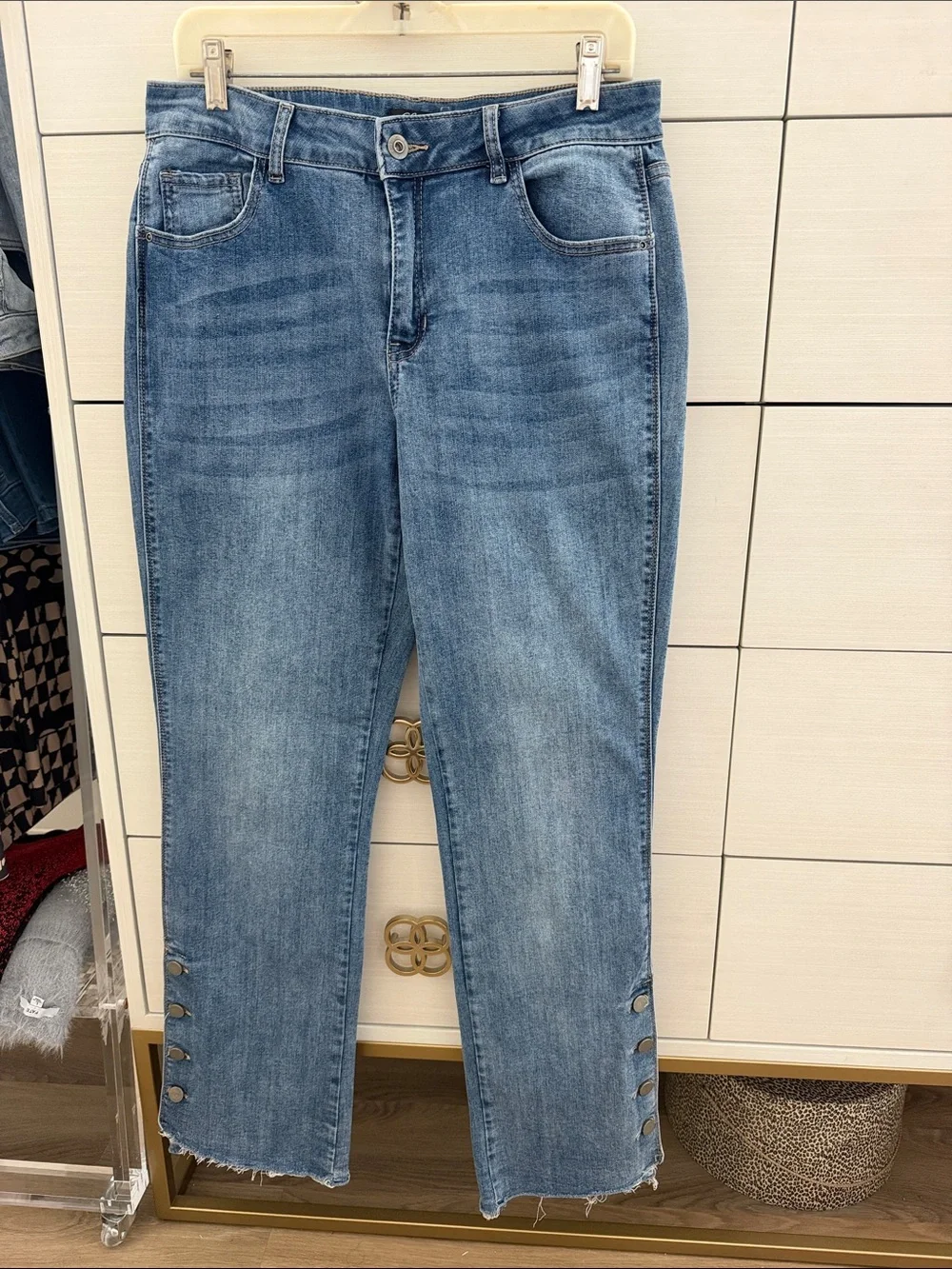 Charlie B Light Wash Button-Hem Straight Jeans with hem button detail.